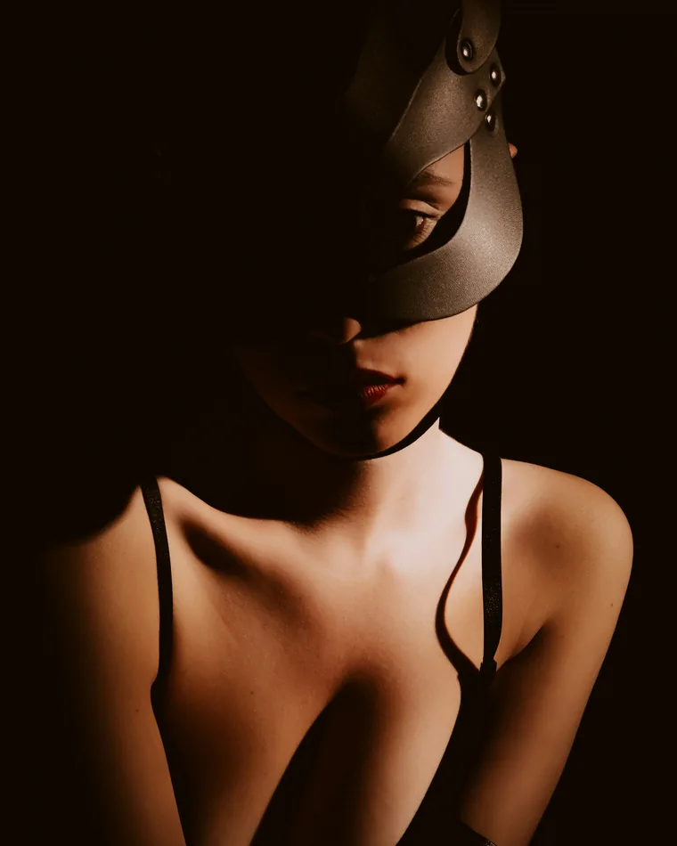 Anonymous creator wearing a mask